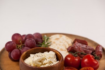 biscuits, cherry tomatoes, grapes, bowl of cheese