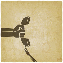 hand with telephone handset