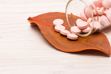 Pink pills with orange leaf
