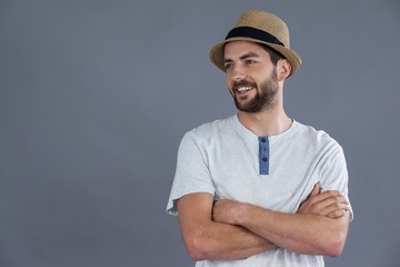 Happy man in white t-shirt and fedora hat  - obrazy, fototapety, plakaty