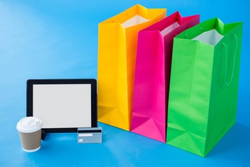 Colorful shopping bags and credit card with digital tablet