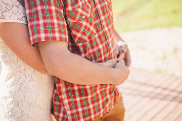 engaged couple hug