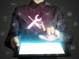 Image of a girl with tablet in her hands. She presses technical support button on virtual screen....