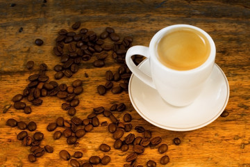 cup of coffee and beans on table