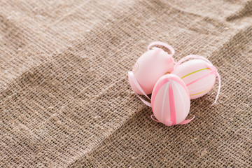 Easter eggs on sackcloth, concept space for copy text, words