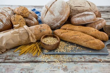 Different types of bread with wheat grains and oats