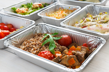 Healthy food take away, top view at wood background