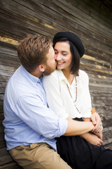 Beautiful hipster couple in love on a date outdoors in park havi