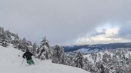 Skiing on top of the snowy olympus mountain