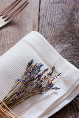 Fototapeta na wymiar Bunch of dry lavender on white napkin, selective focus