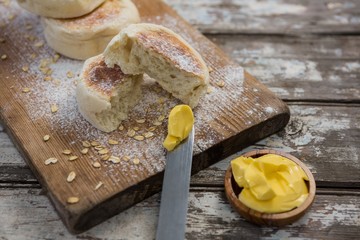 Buns with wheat flour, butter and butter knife