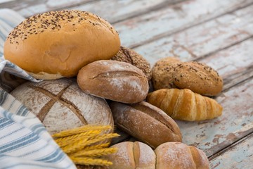 Different types of bread with wheat grains