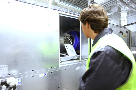 Man checking electrical switchgear