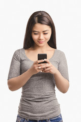 Fototapeta premium Casual Asian girl with phone. Smiling.