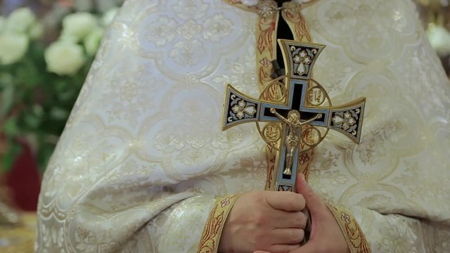 Priest holding orthodox cross