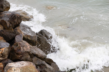 Sea waves breaking on a rocks Deep blue hit cliff. . Mighty . splashing over . Strong ocean hitting