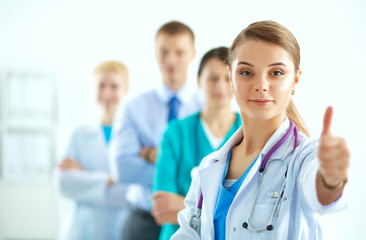 Fototapeta premium Group of doctors at hospital , woman showing ok