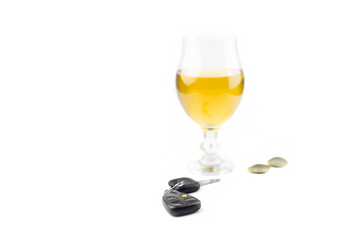 Car Keys And Beer Glass On White Background