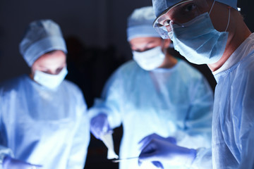 Team surgeon at work in operating room