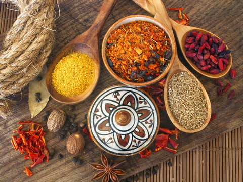 Dry Spices On The Wooden Board And African Ceramics