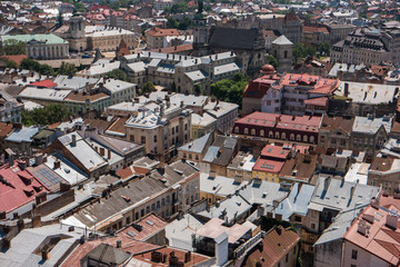 Buildings of town. Rooftops and sunlight. Townscape during daytime.