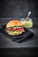 Rare roast beef burger with rocket and mayonnaise