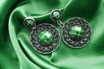 Earrings on satin © Tarzhanova