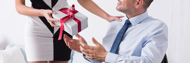 Man taking present from wife