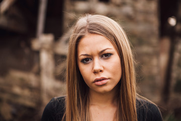 Naklejka premium Beautiful blonde girl with sad expression