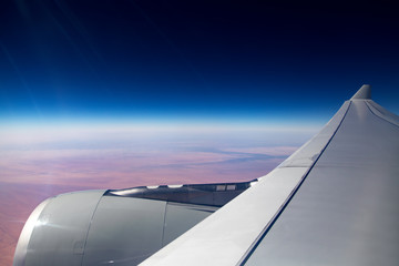 Fototapeta na wymiar View from air plane window, flying over desert