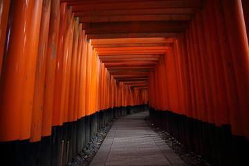 Red Tori Gate at Fushimi Inari Shrine in Kyoto , Japan