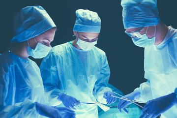 Team surgeon at work in operating room
