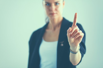 Woman touching an imaginary screen with her finger