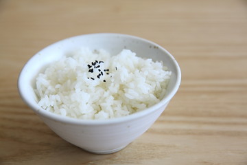 Rice on wood background