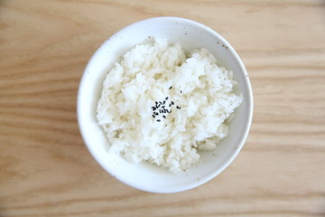 Rice on wood background