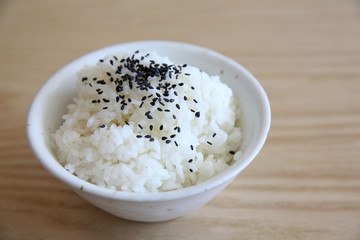 Rice on wood background