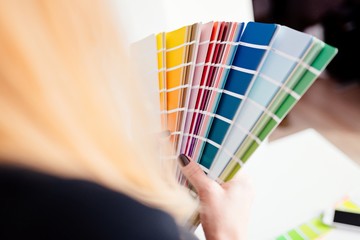 Woman designer or architect choosing color