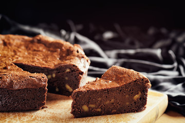 Piece of freshly baked chocolate brownie cake. Sweet dessert