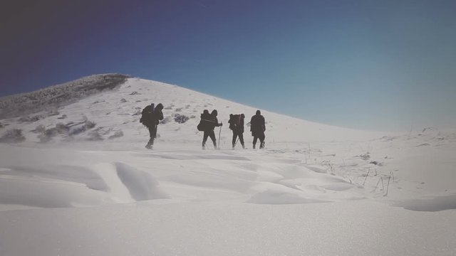 The operator takes on the video climbers in the mountains. Vignette color correction