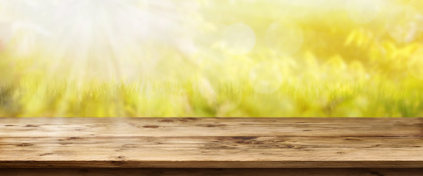 Sun in spring in front of a wooden table