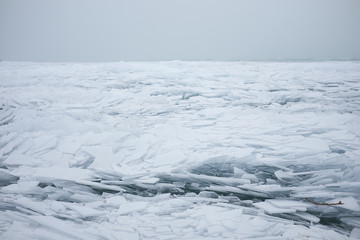 Ice cracks on the surface of a lake © Creaturart