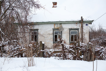 horizontal image of the an old abandoned burned house