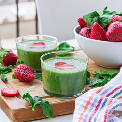 Green spinach smoothie with strawberry