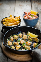 Selection of seafood meal on wood background