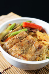 fried garlic rice with pork on black background