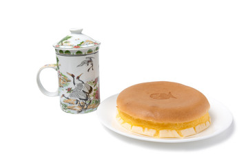 Fish cake with teapot  on white background