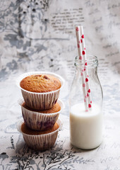 Delicious homemade cupcakes or muffins with cherry berry and milk - breakfast or dessert idea for kids © siamese