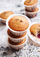 Homemade cupcakes or muffins with cherry berry and milk, closeup, selective focus, blank space for your text or recipe