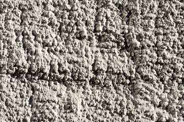 closeup of a pebbledashed wall
