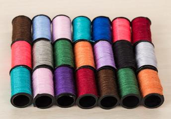 rows of threads of diffrent colors